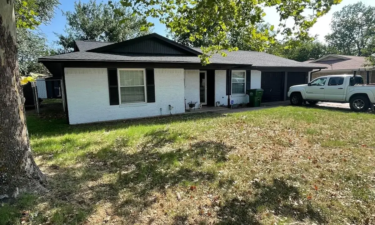 Professional roofing crew working on a residential roof in Waipio Acres